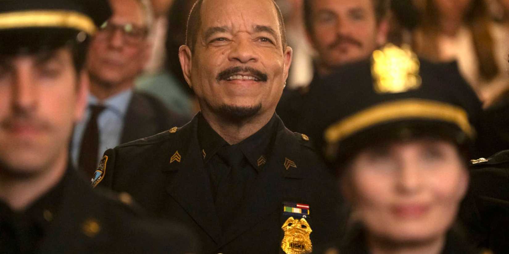 Fin smiling widely and wearing dress uniform in Law & Order: SVU