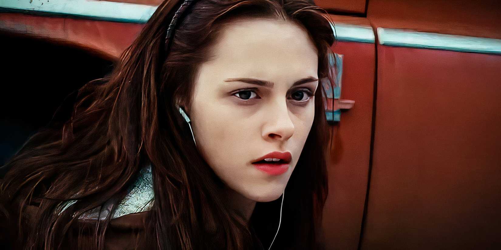 Bella crouching next to her red truck in Twilight