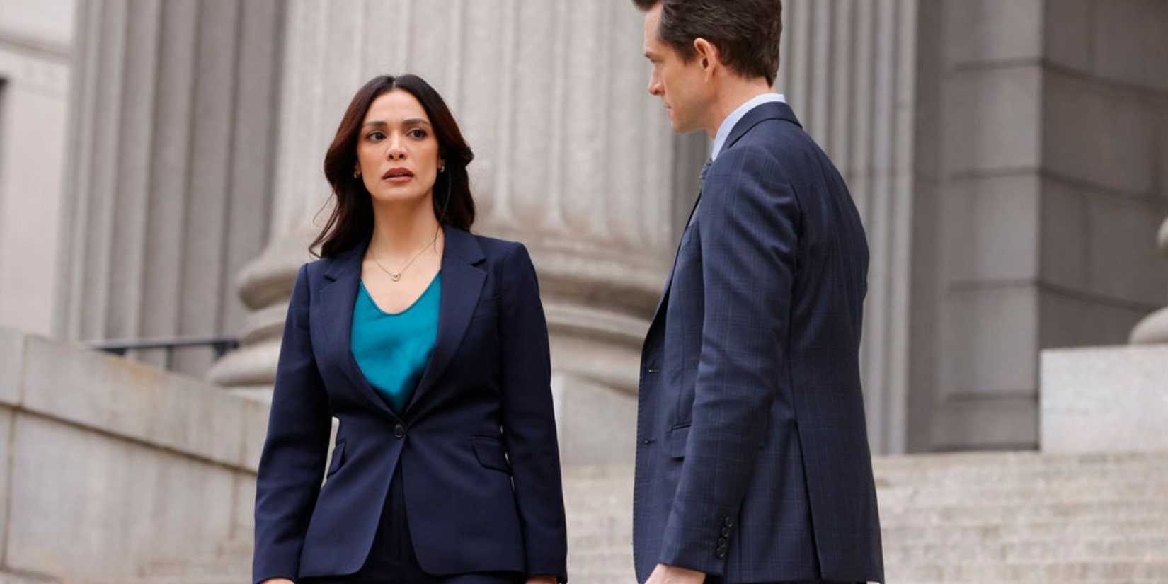 Law & Order Maroun standing with Price on the courthouse steps and looking upset