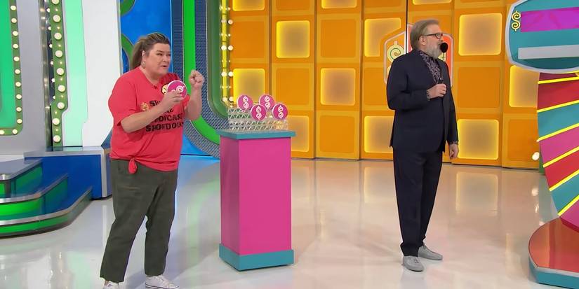 The Price is Right's Drew Carey stands on the stage with a contestant named Lisa
