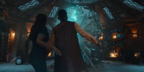 The Doctor and Belinda looking at the Story Engine in Doctor Who