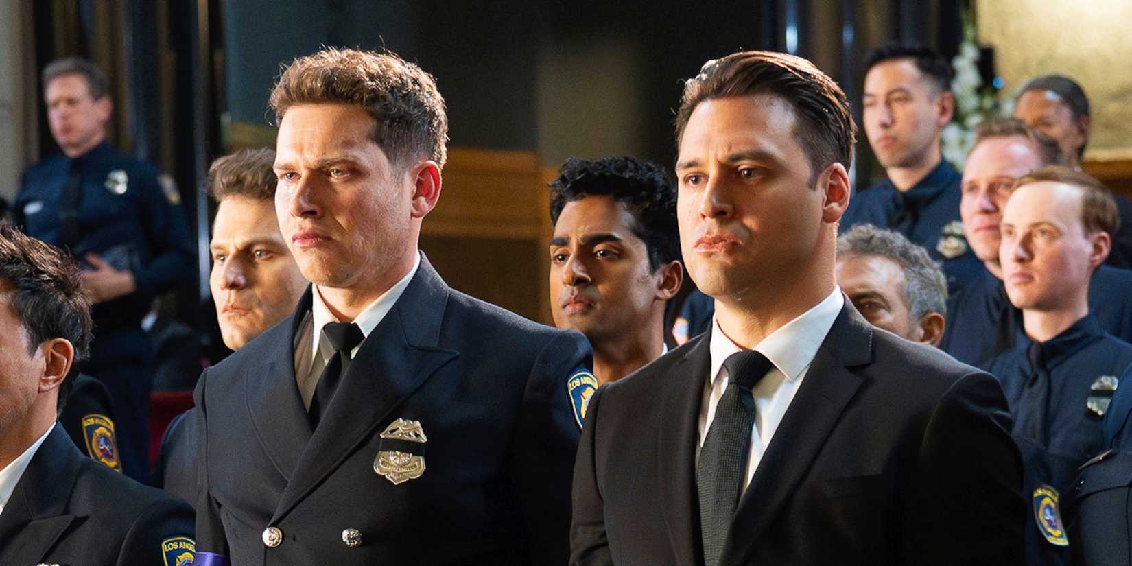 Buck (Oliver Stark) and Eddie (Ryan Guzman) at Bobby's funeral in 9-1-1 season 8, episode 16.