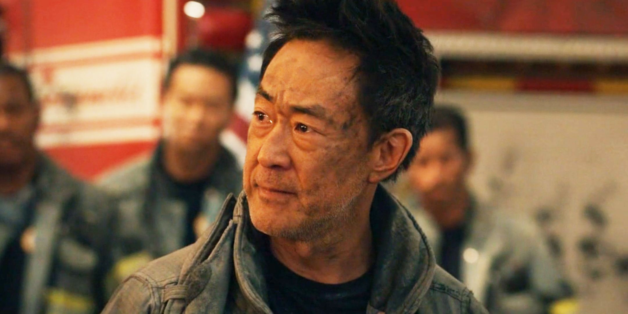 9-1-1 season 8 Howard Han looking to the side with tears in his eyes