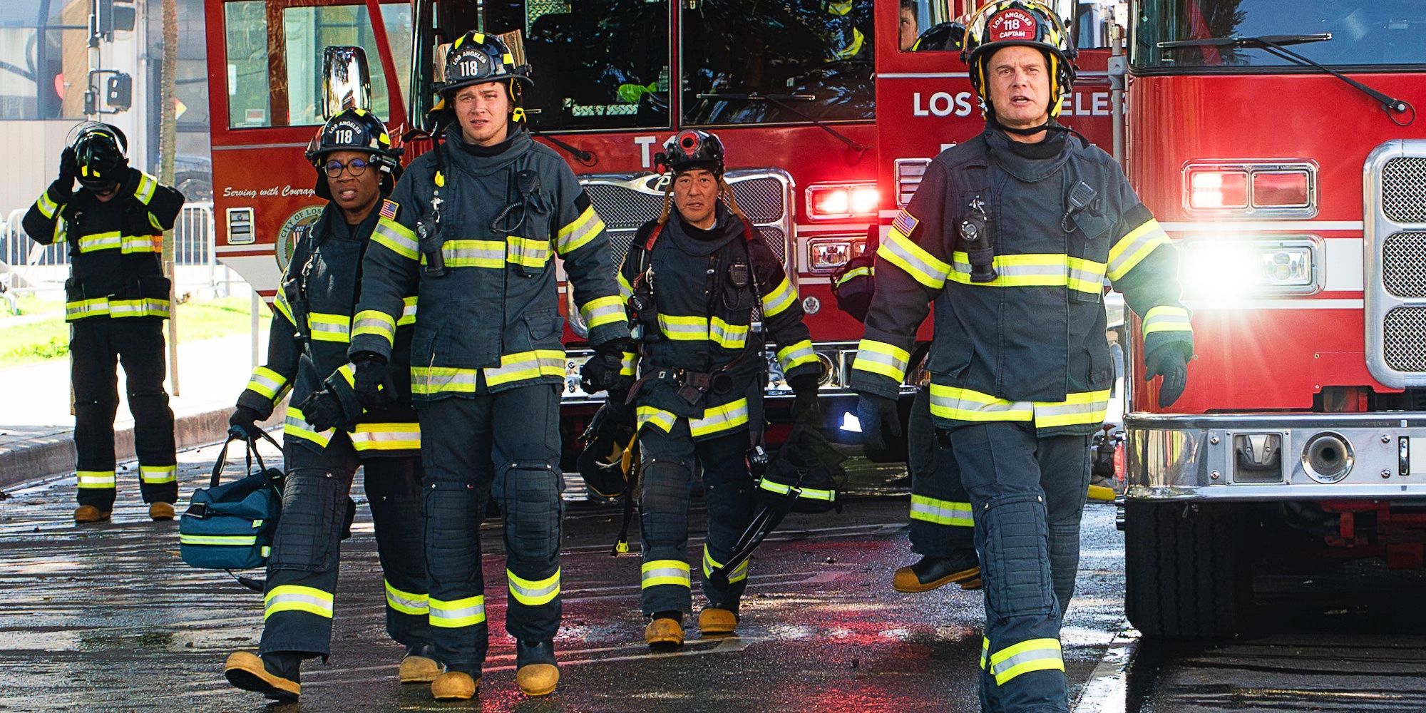 Hen Wilson (Aisha Hinds), Evan Buckley (Oliver Stark), Chimney Han (Kenneth Choi), and Bobby Nash (Peter Krause) walking towards an emergency in 9-1-1 season 8.