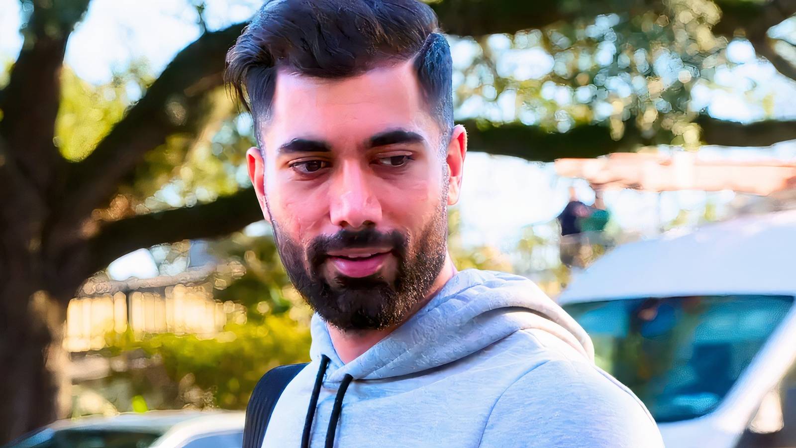 A close up of 90 Day Fiancé’s Mahdi Al-Saadi standing outdoors