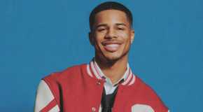 Ace Greene from Love Island USA Season 7 smiling on a blue background.