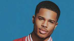 Ace Greene from Love Island USA Season 7 smiling on a blue background.