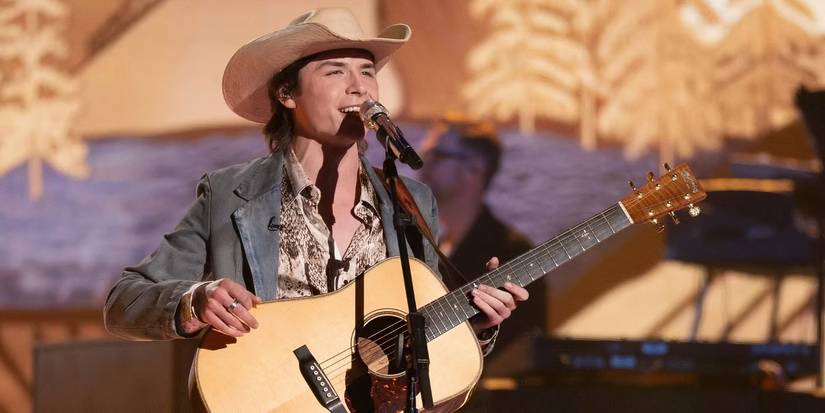 American Idol Season 23 Contestant John Foster Singing On Stage With His Guitar