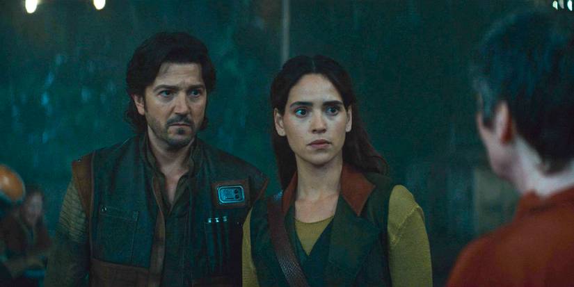 Cᴀssian Andor (Diego Luna) and Bix Caleen (Adria Arjona) speaking to a Force healer in Andor Season 2 Episode 7