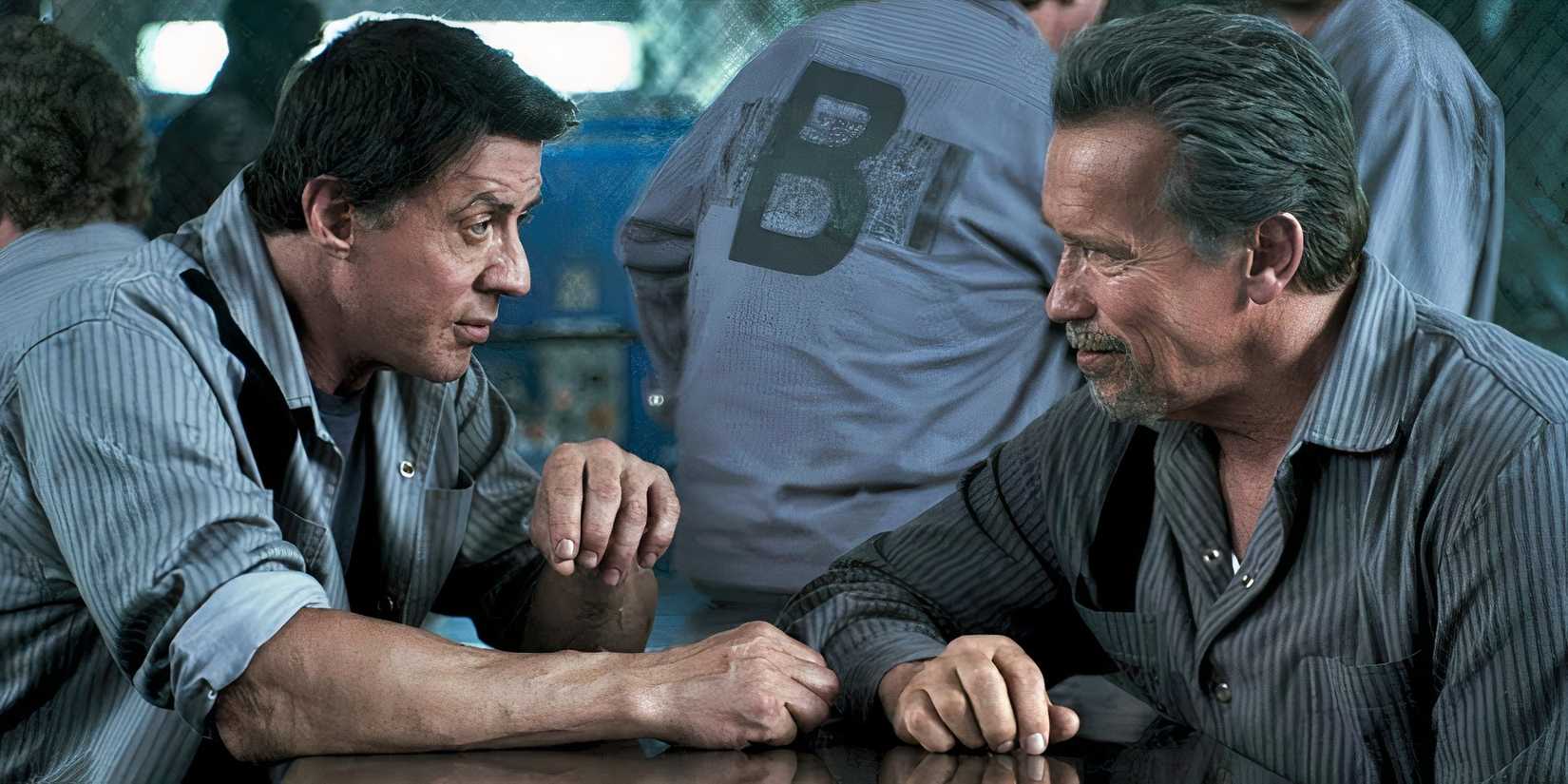 Sylvester Stallone and Arnold Schwarzenegger sit across from one another during a conversation.
