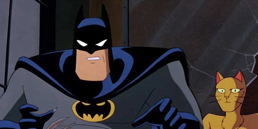 Batman stands in front of Catwoman transformed into a cat woman in Batman the animated series