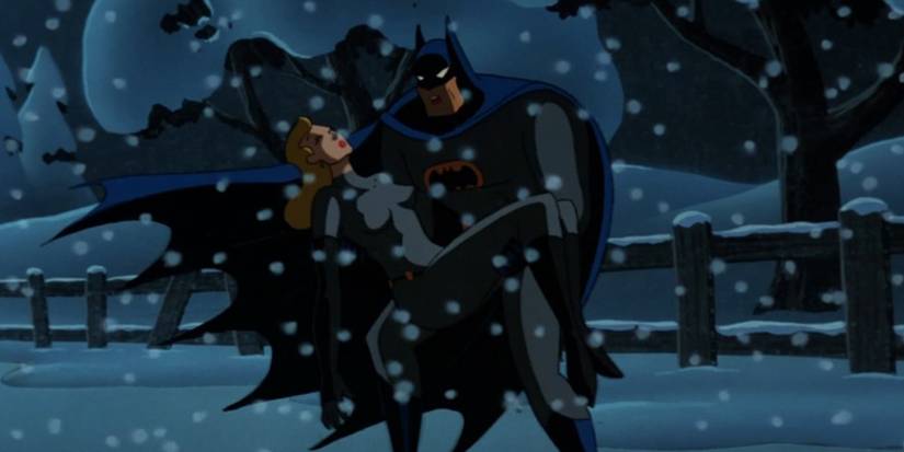 Batman carries Catwoman in the snow in Batman The Animated Series Cat Scratch Fever