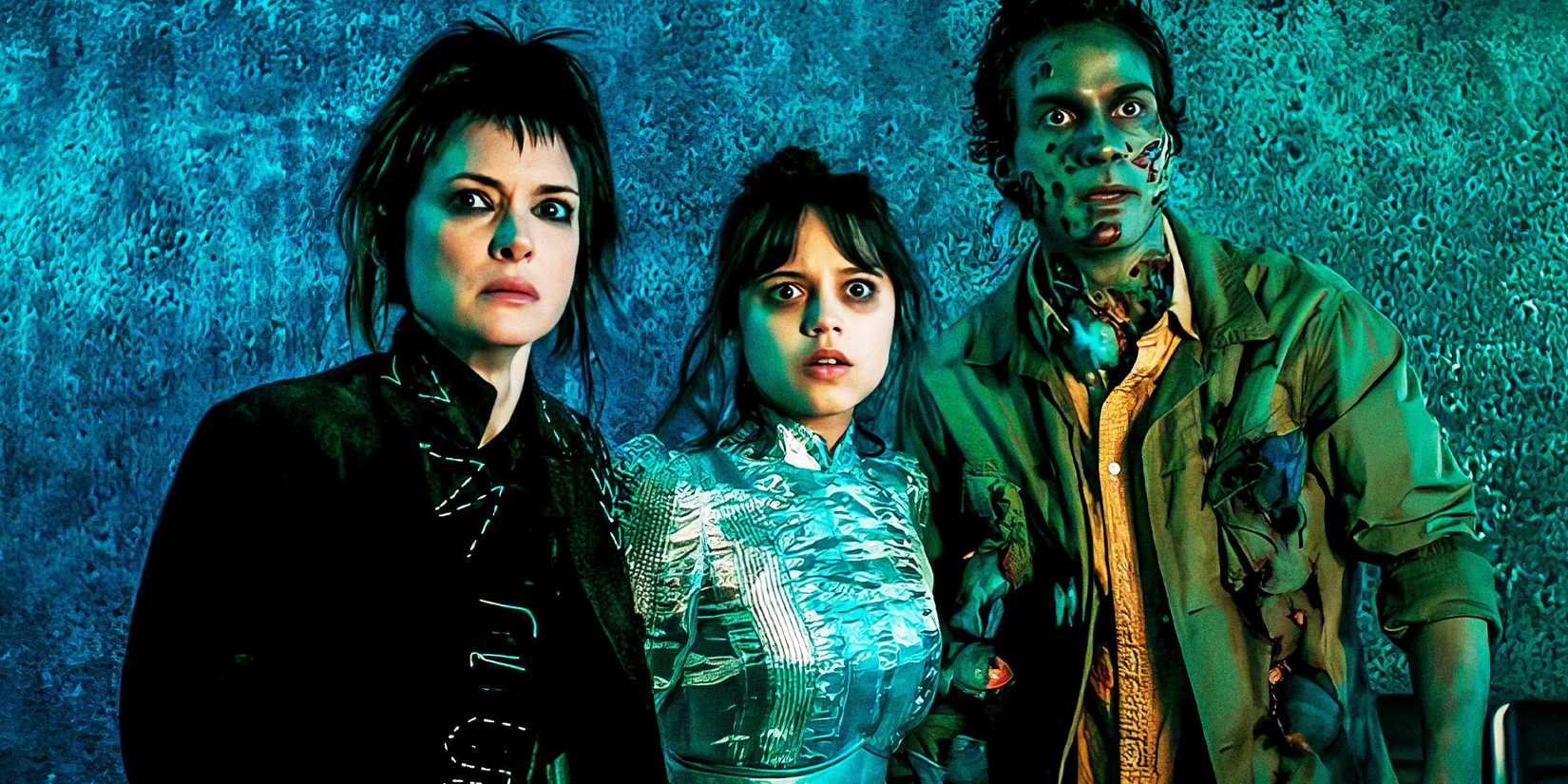 Winona Ryder, Jenna Ortega and Santiago Cabrera looking shocked in Beetlejuice Beetlejuice