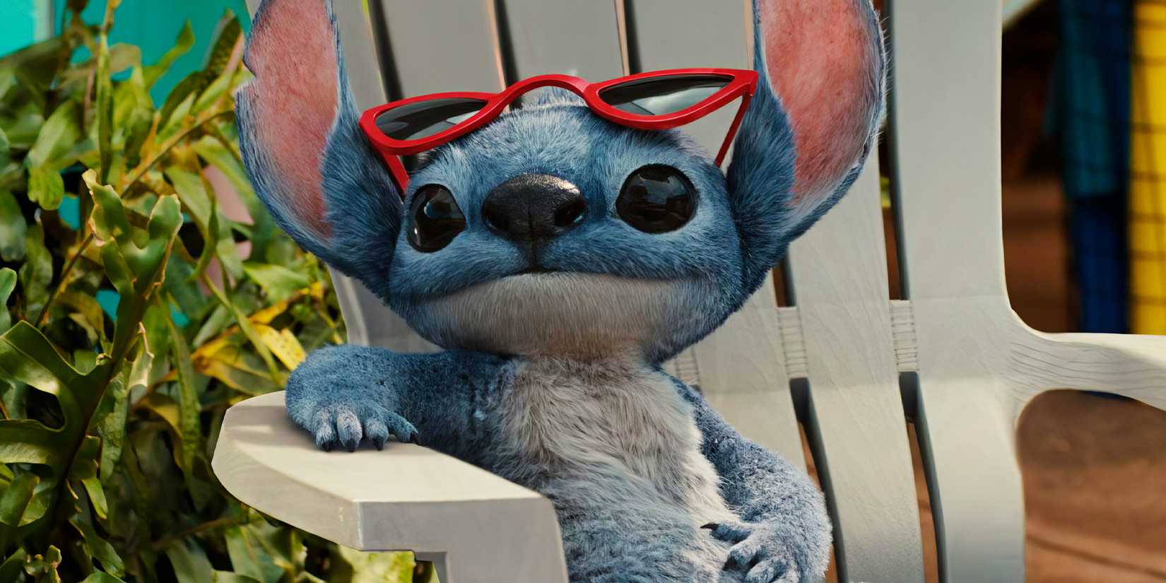 Sтιтch sitting in a lawn chair with sunglᴀsses on his head in Lilo & Sтιтch 2025