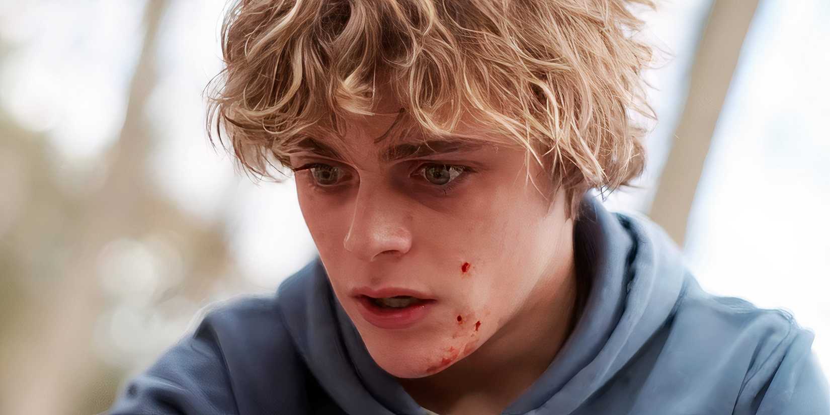 Billy Barratt as Andy looking shocked with blood on his face in Bring Her Back