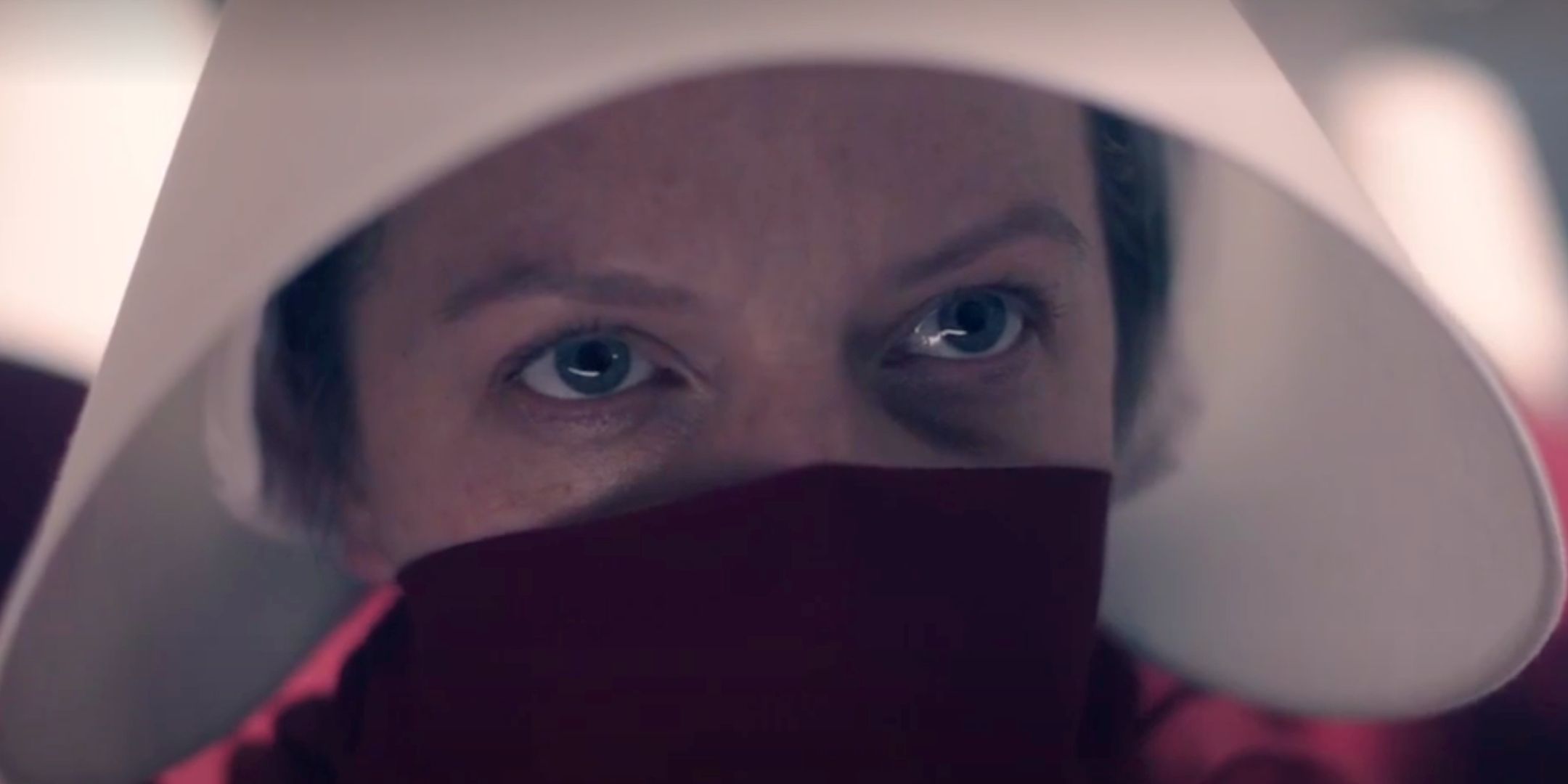 Close-up of June (Elisabeth Moss) in a handmaids uniform in The Handmaid's Tale season 6