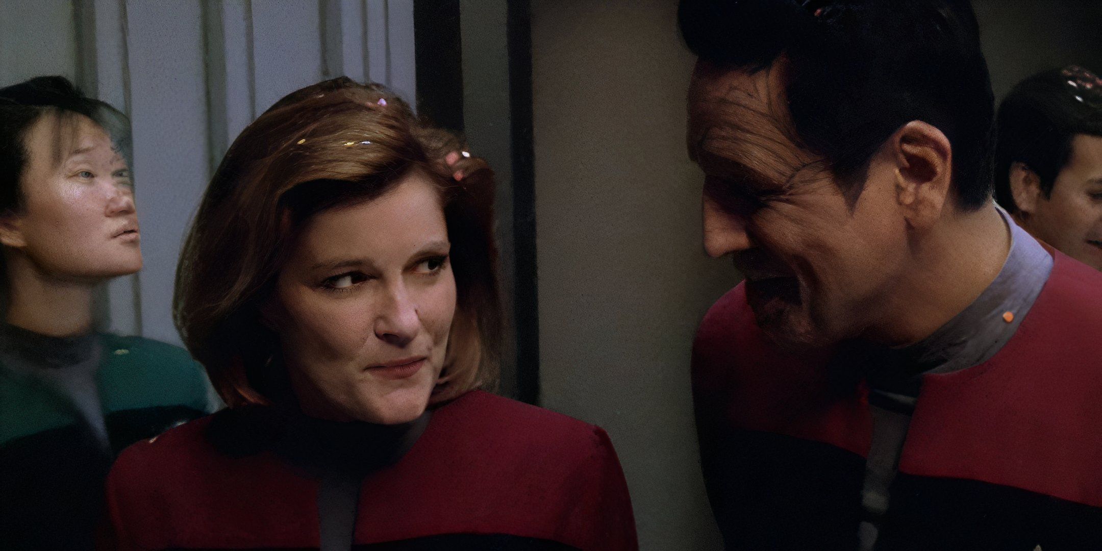 Commander Chakotay (Robert Beltran) and Captain Kathryn Janeway (Kate Mulgrew) smile at each other in Voyager Timeless