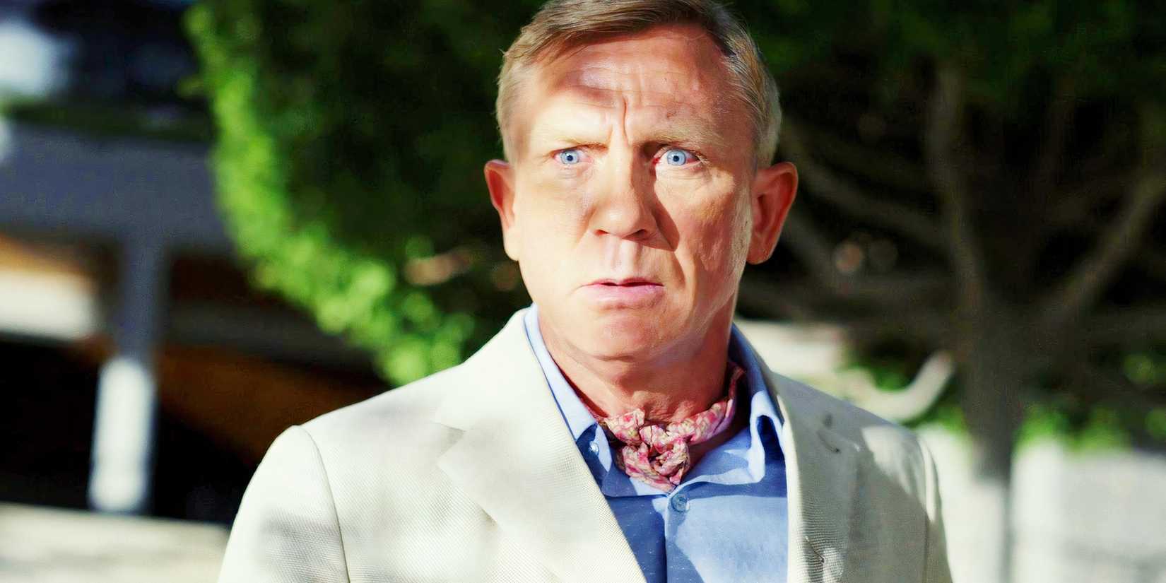 Daniel Craig as Benoit Blanc looking shocked in Glass Onion A Knives Out Mystery