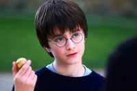 Daniel Radcliffe as Harry Potter Holding a Snitch in Sorcerer's Stone
