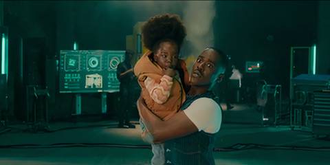 The Doctor holding Poppy with a wide-eyed expression in the Doctor Who season 15 finale