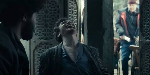 Donal Finn laughing heartily in Wheel of Time season 3 blooper reel