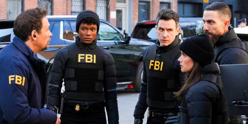 The main cast of FBI in their vests on the street