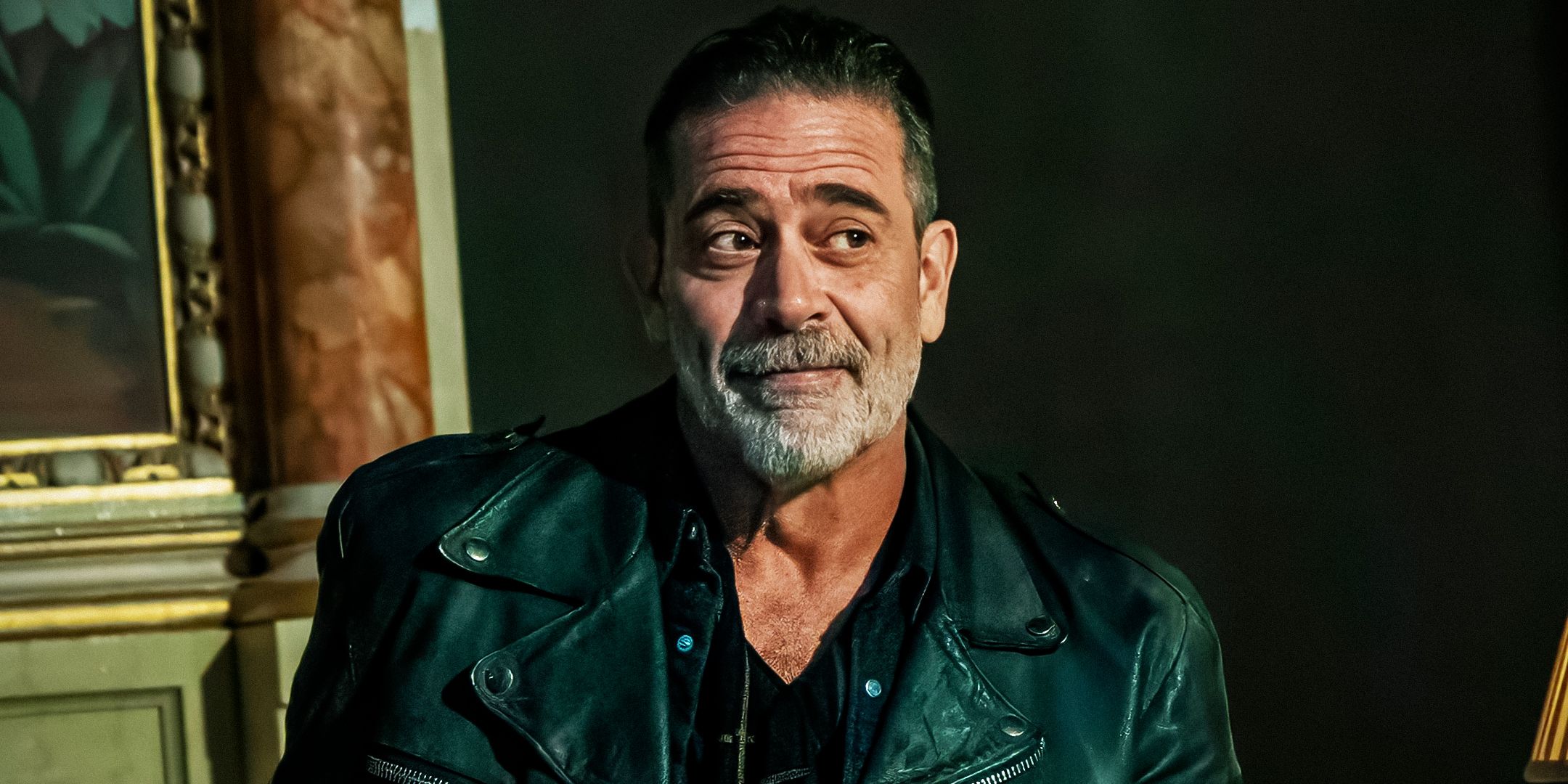 Close-up of Jeffrey Dean Morgan as Negan smiling in The Walking Dead: Dead City season 2