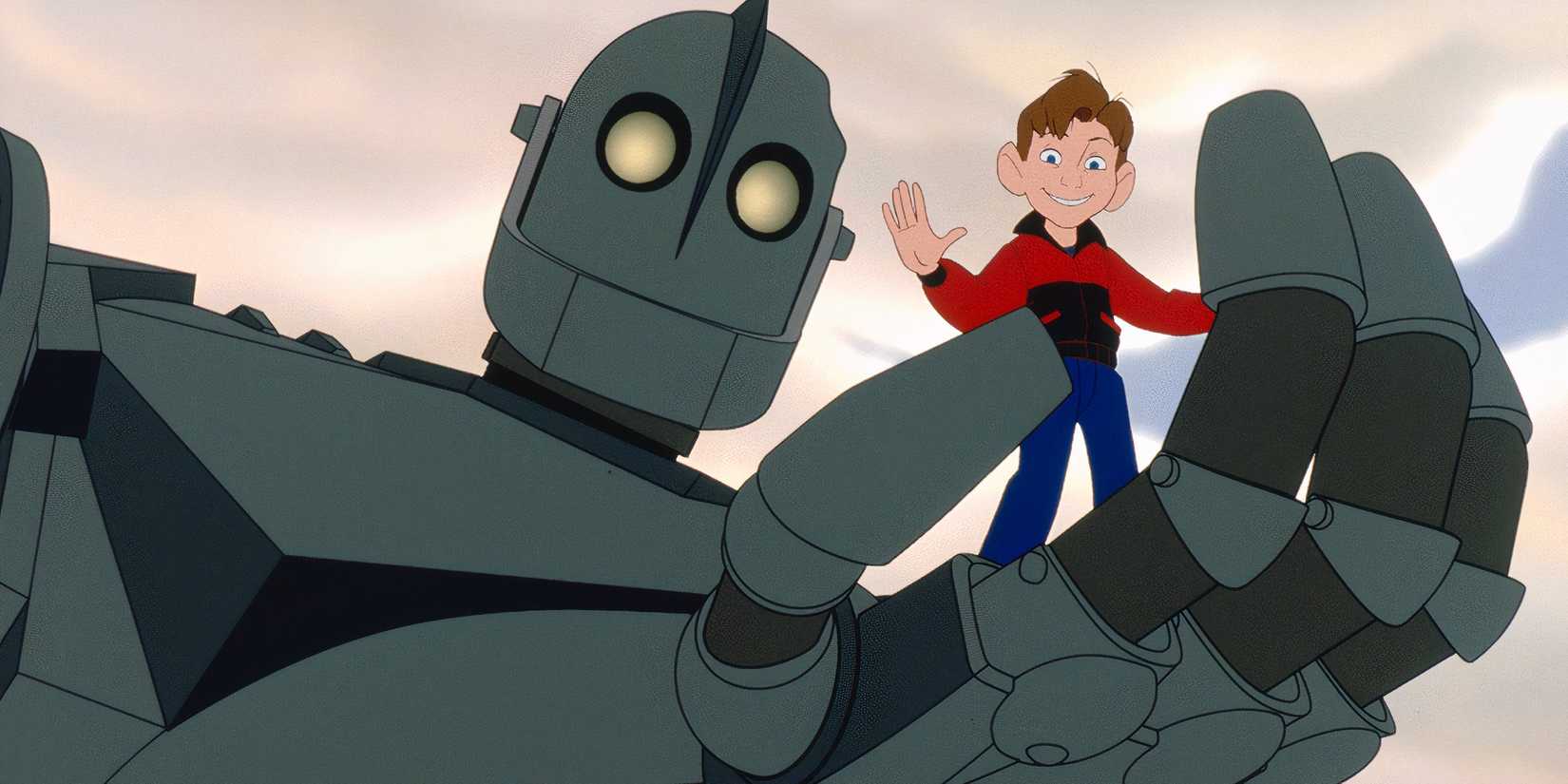 The Iron Giant holding a waving Hogarth in his metal hand