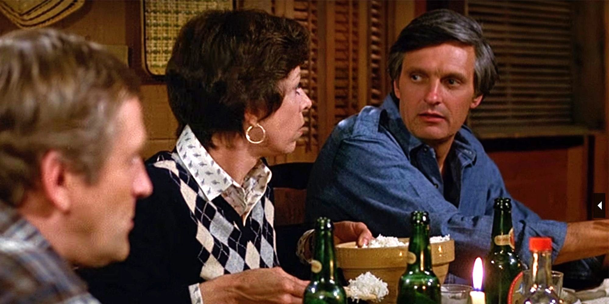 Jack and Kate looking at each other at a table in The Four Seasons movie