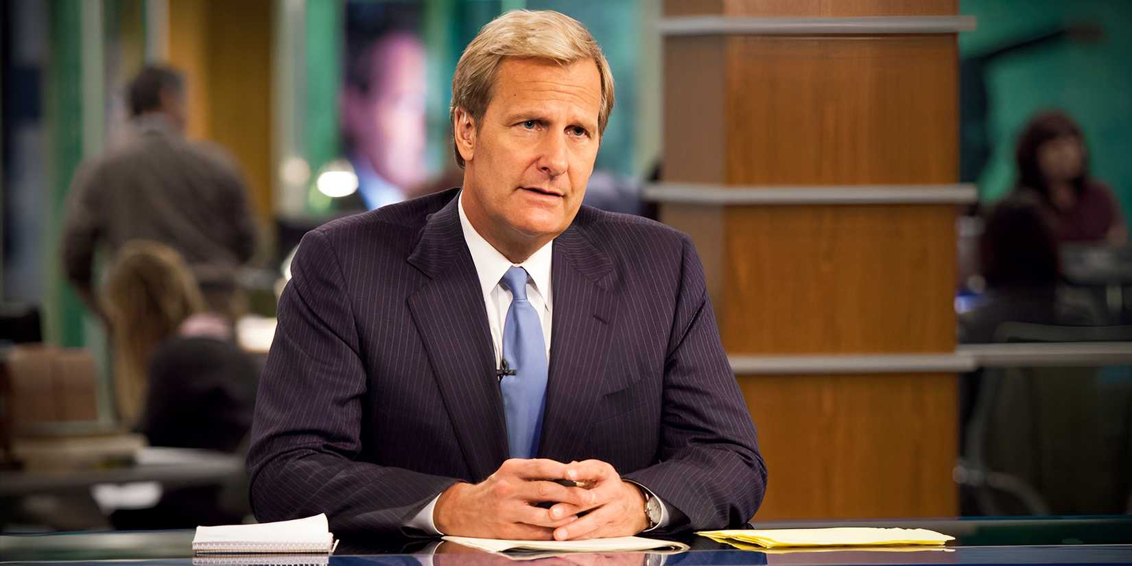 Jeff Daniels sitting at his desk in The Newsroom