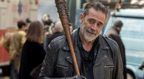Jeffrey Dean Morgan as Negan holding a baseball bat and smiling in The Walking Dead: Dead City season 2