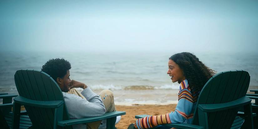 Justin and Shannon sit on the beach in Netflix's Forever