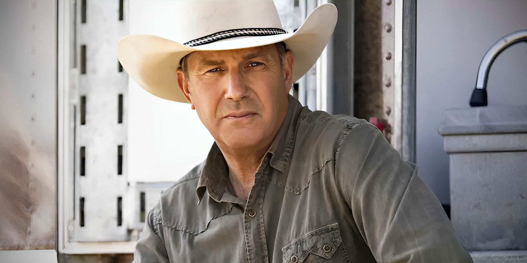 Kevin Costner in Yellowstone in a western hat, looking to camera