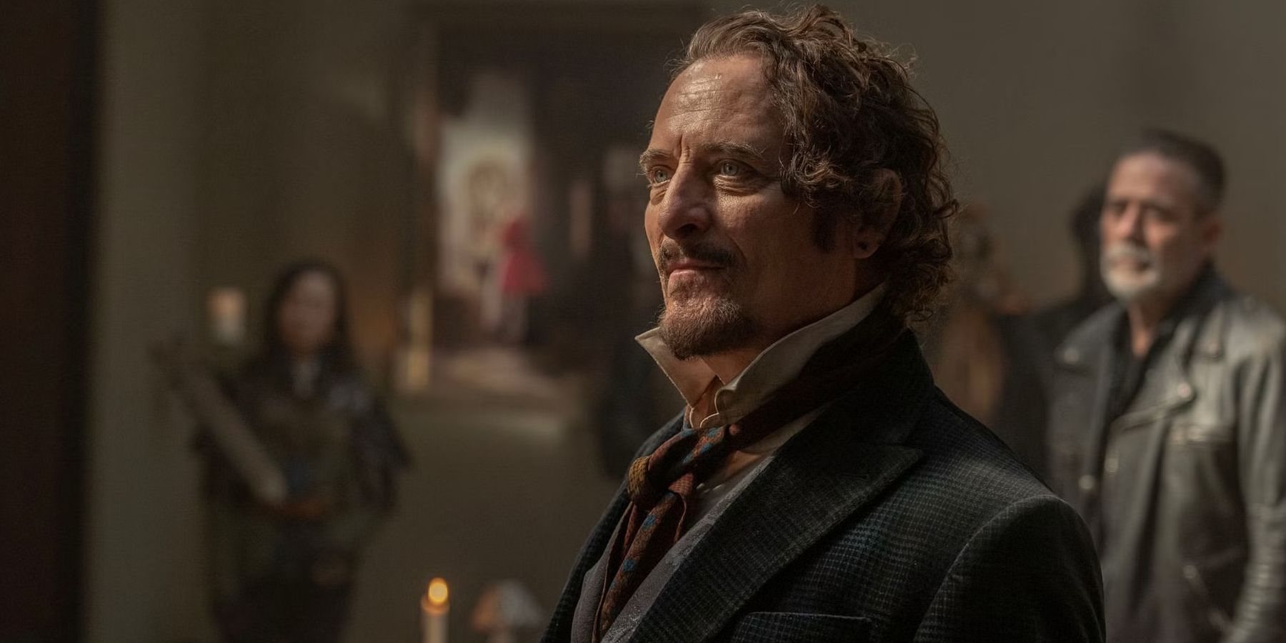 Kim Coates as Bruegel looking forward with Negan (Jeffrey Dean Morgan) standing in the background in The Walking Dead: Dead City season 2