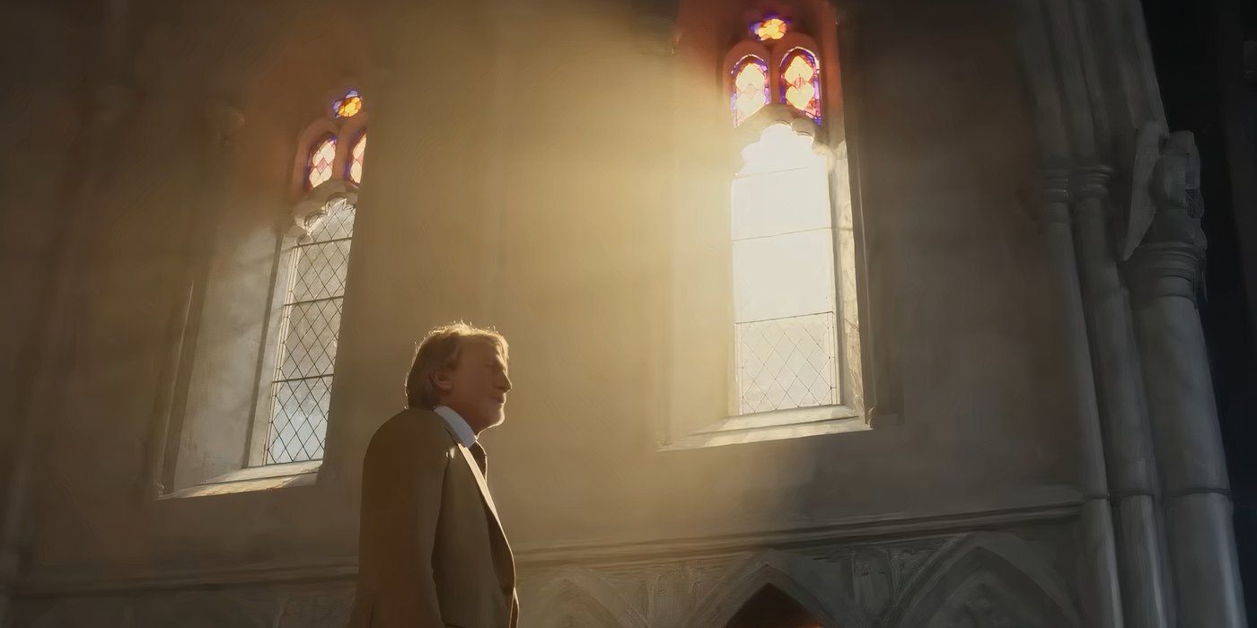 Daniel Craig walking in a church as Benoit Blanc as light shines on him through a window in Wake Up Dead Man A Knives Out Mystery