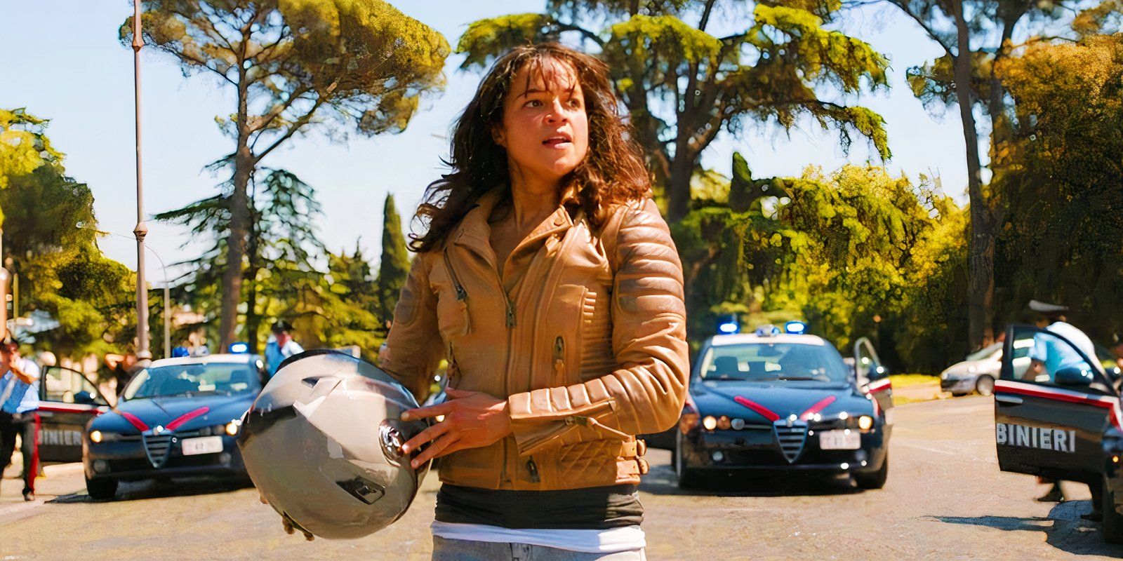 Letty removes her helmet while surrounded by cops in Fast X