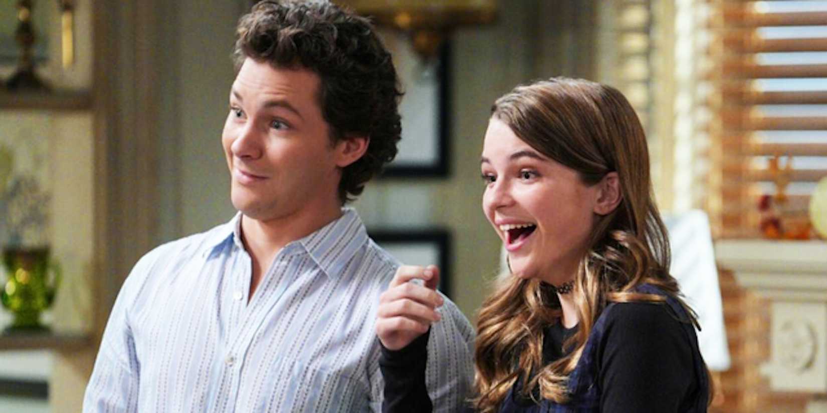 Montana Jordan's Georgie and Raegan Revord's Missy smile in the kitchen from Georgie & Mandy's First Marriage