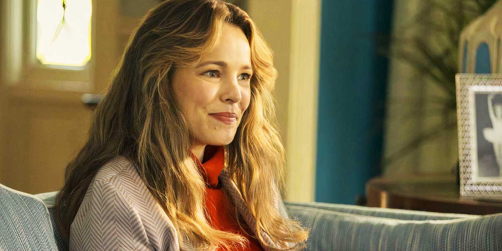 Rachel McAdams' Barbara sits on the couch in Are You There God? It's Me, Margaret.