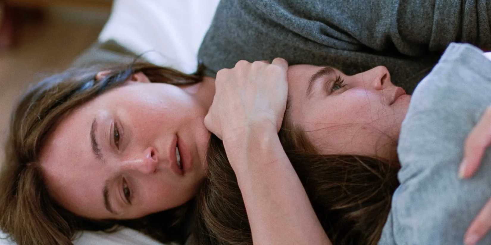 Renate Reinsve cradles a woman's head in Sentimental Value