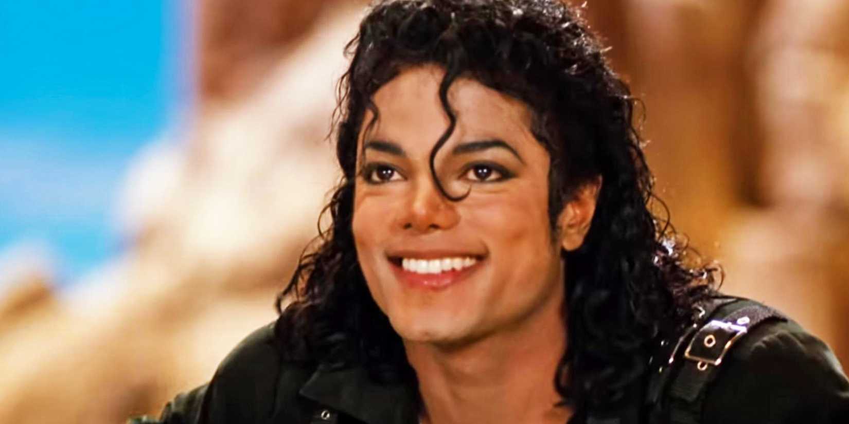 Michael Jackson smiles at the end of the short film for his song "Speed Demon" from the Bad album.