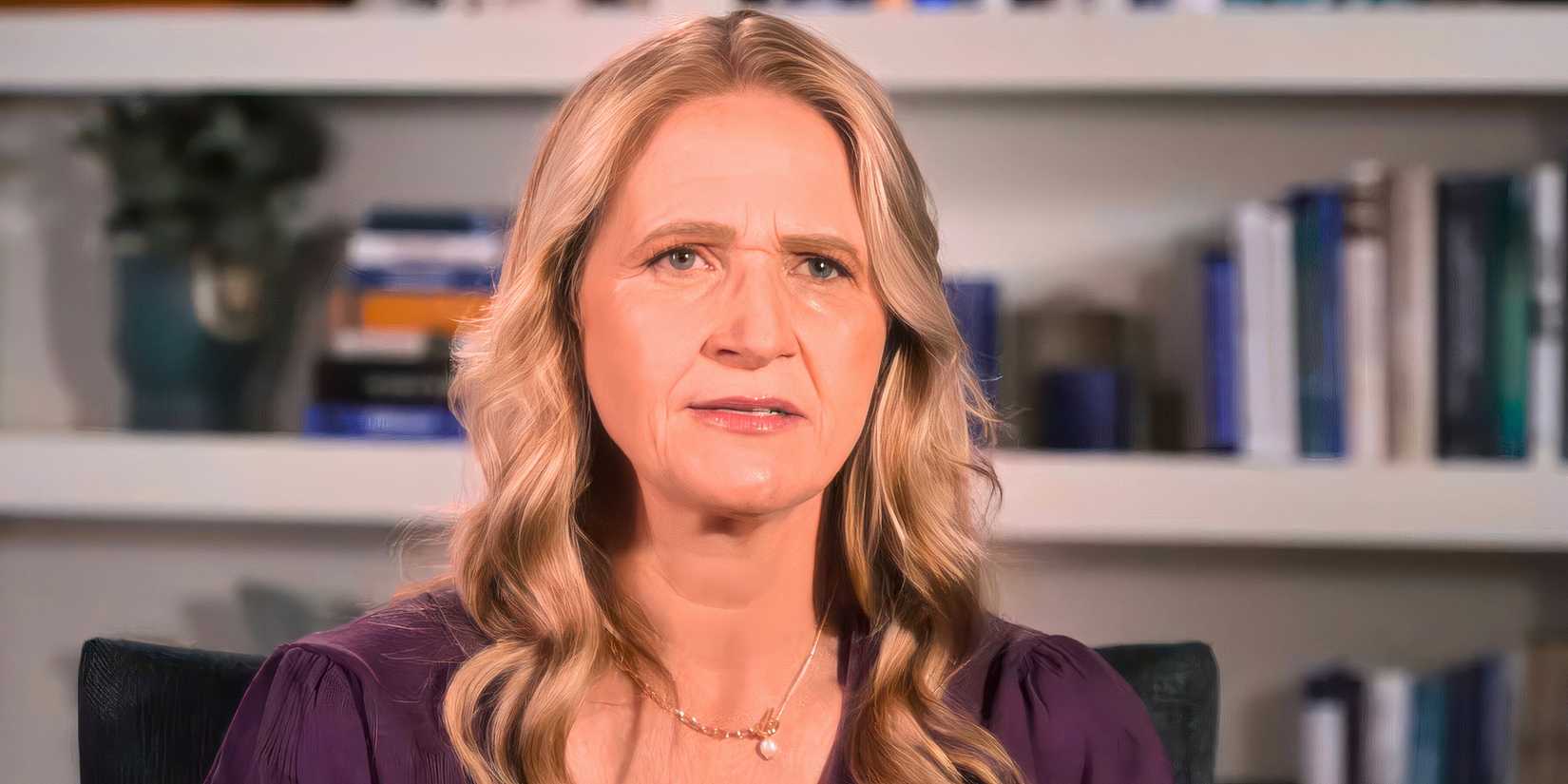 Sister Wives Christine Brown wearing purple blouse curly hair