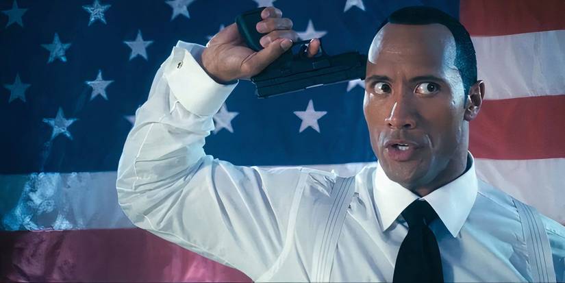 The Rock points a gun at his head in Southland Tales