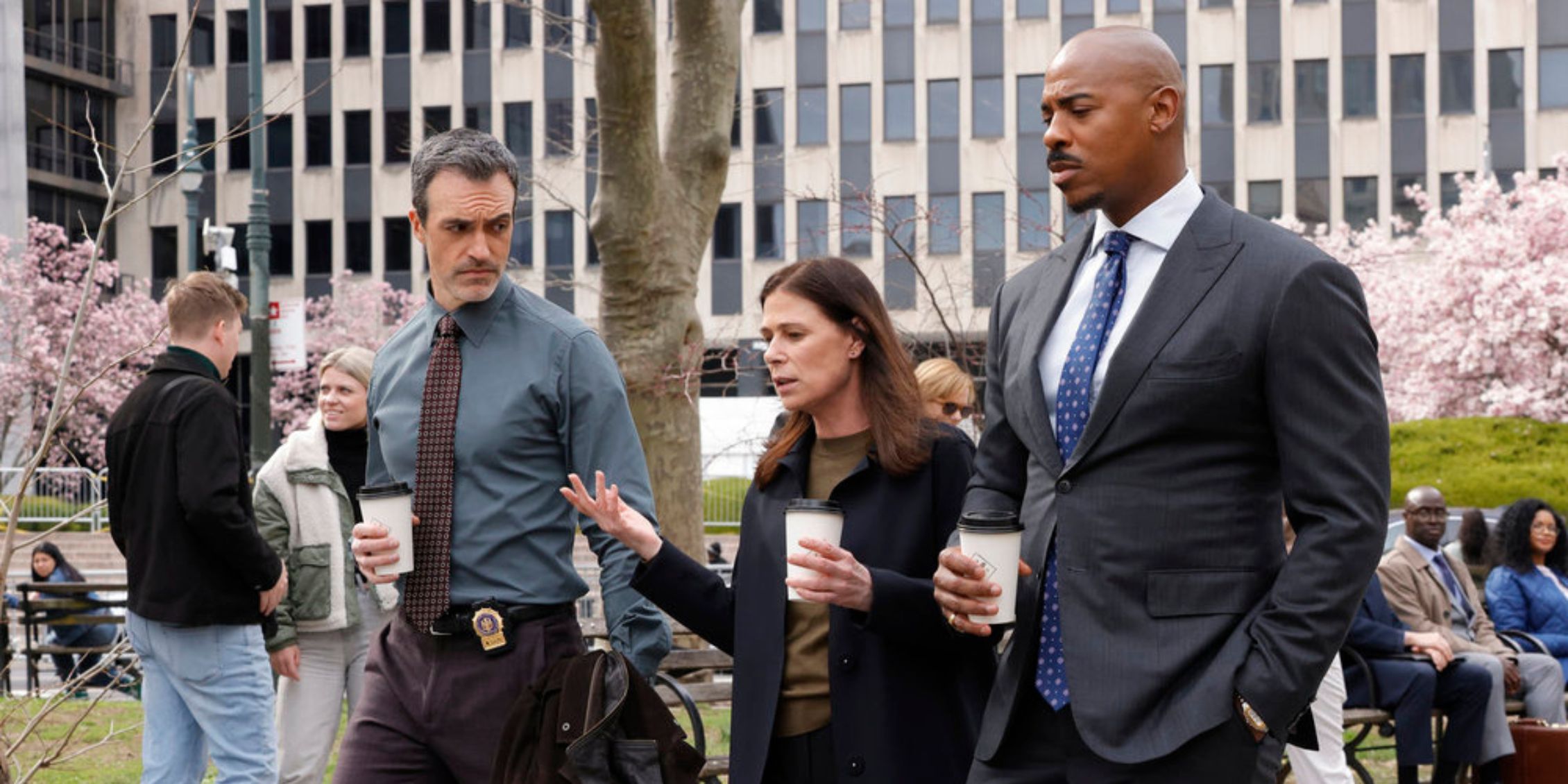 Shaw, Riley, and Brady walk with coffee cups in Law & Order