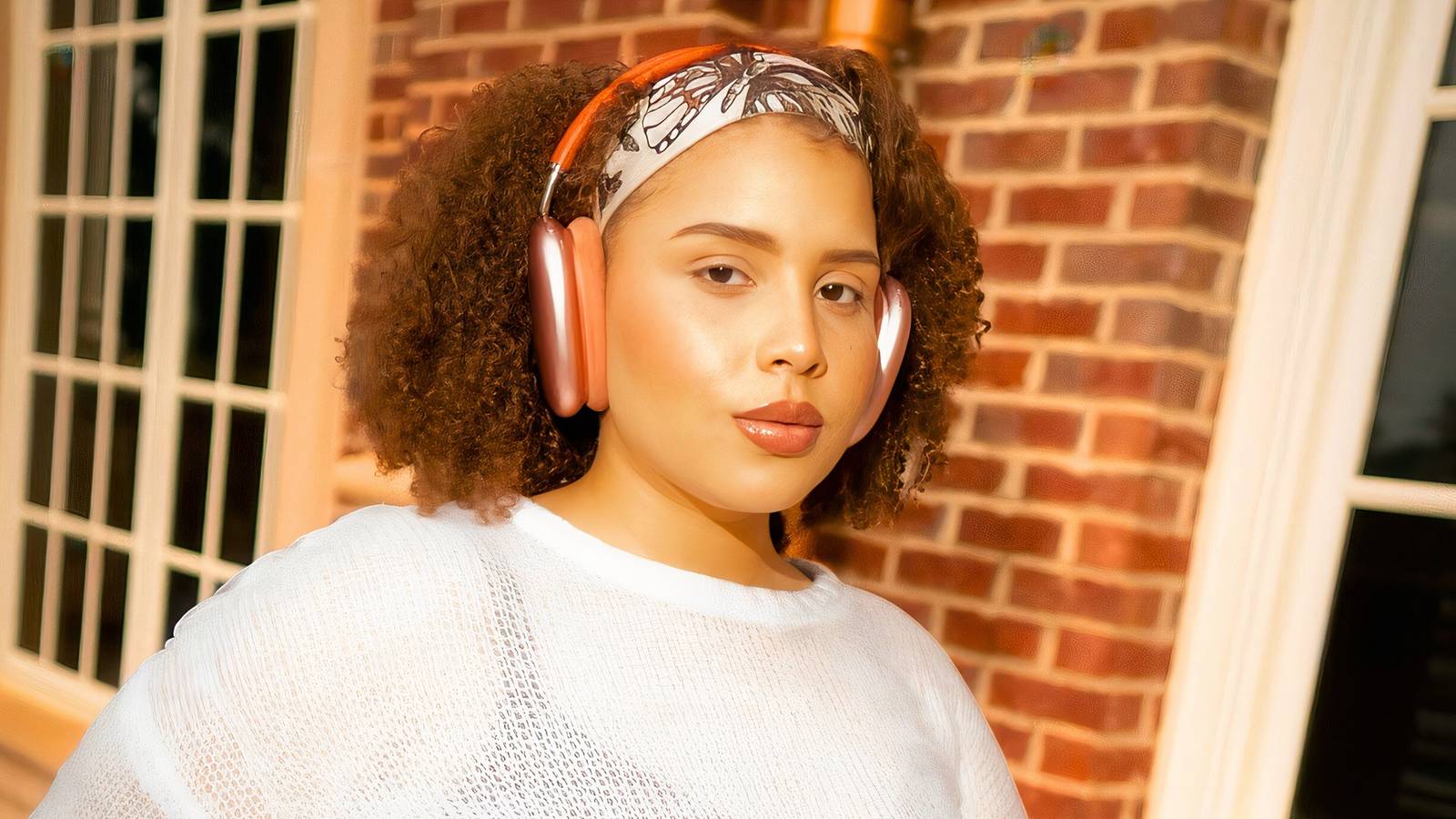 The Family Chantel Winter Everett working out with headphones in white shirt