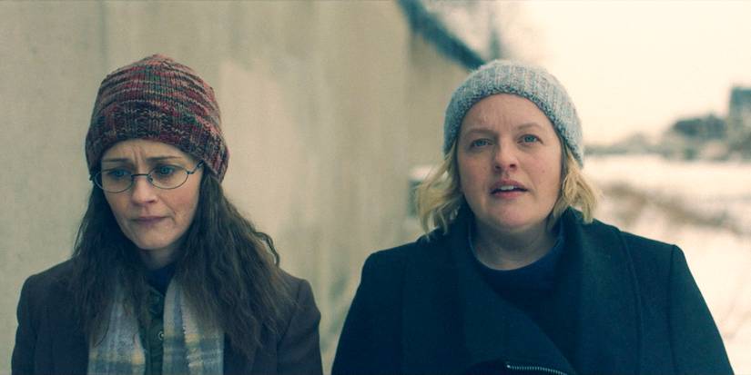 Emily (Alexis Bledel) and June (Elisabeth Moss) walking through Boston after being freed in The Handmaid's Tale Season 6 Ep 10