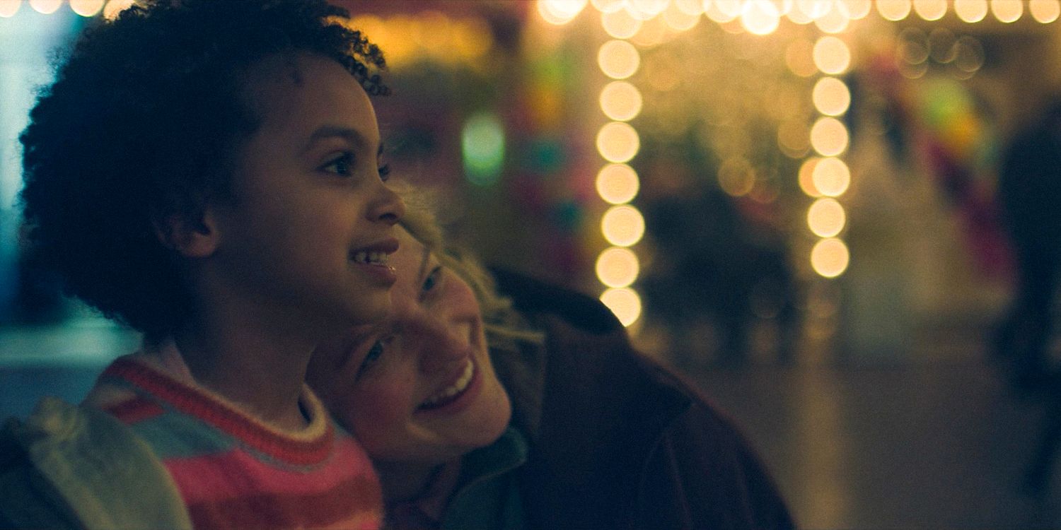 Hannah (Kenzyn Hoffman) and June (Elisabeth Moss) happily enjoying the fair in The Handmaid's Tale Season 6 Ep 10