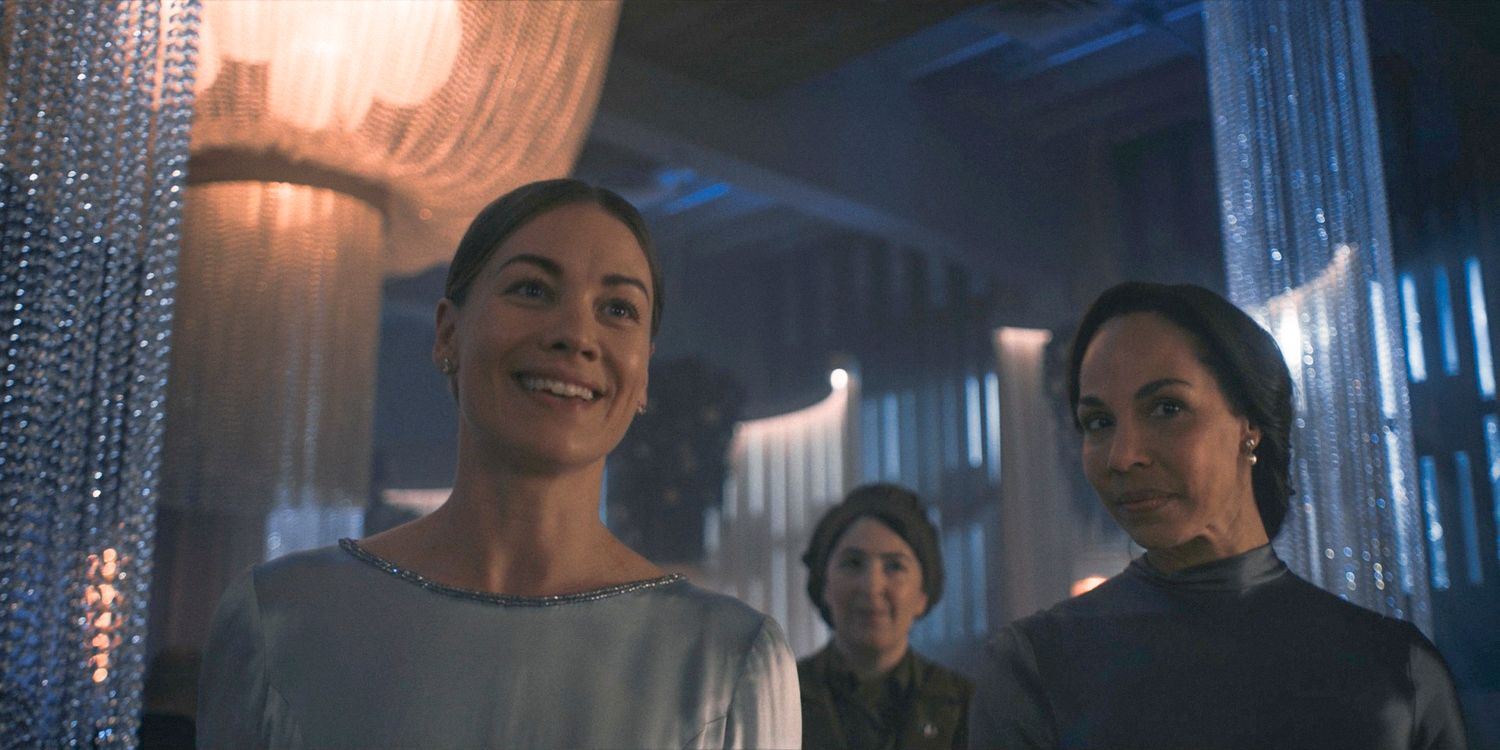 Serena (Yvonne Strahovski) giving a speech to the handmaids at her wedding celebration, with Rita (Amanda Brugel) standing behind her in The Handmaid's Tale Season 6 Ep 8