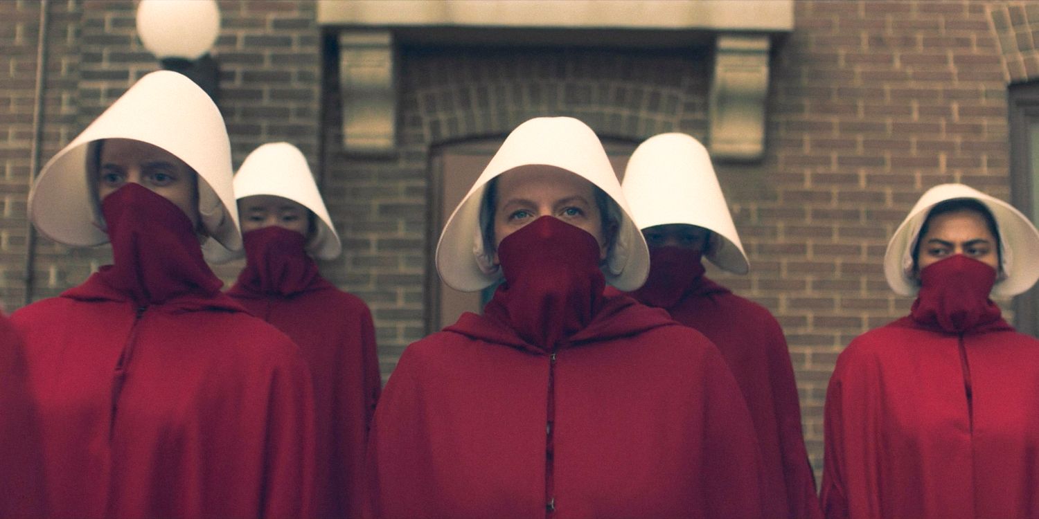 June (Elisabeth Moss) at the front of a group of handmaids, ready to start the rebellion in The Handmaid's Tale Season 6 Ep 8