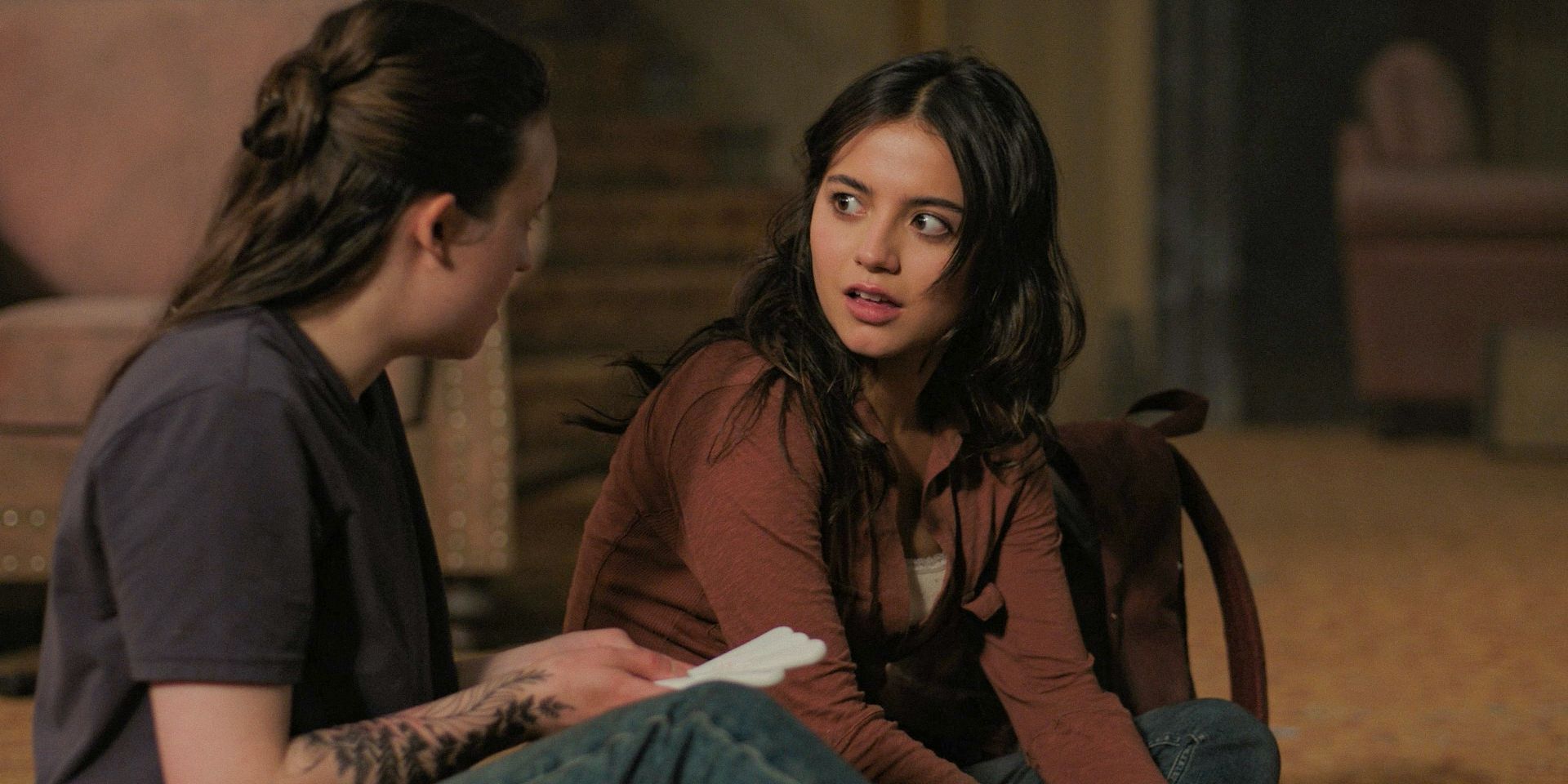 Dina (Isabela Merced) and Ellie (Bella Ramsey) talking in The Last of Us Season 2 Ep 4