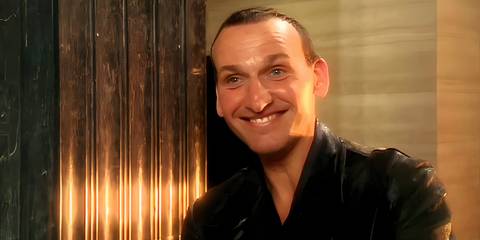 The Ninth Doctor smiling as he dances to Tainted Love in Doctor Who season 1, episode 2, 